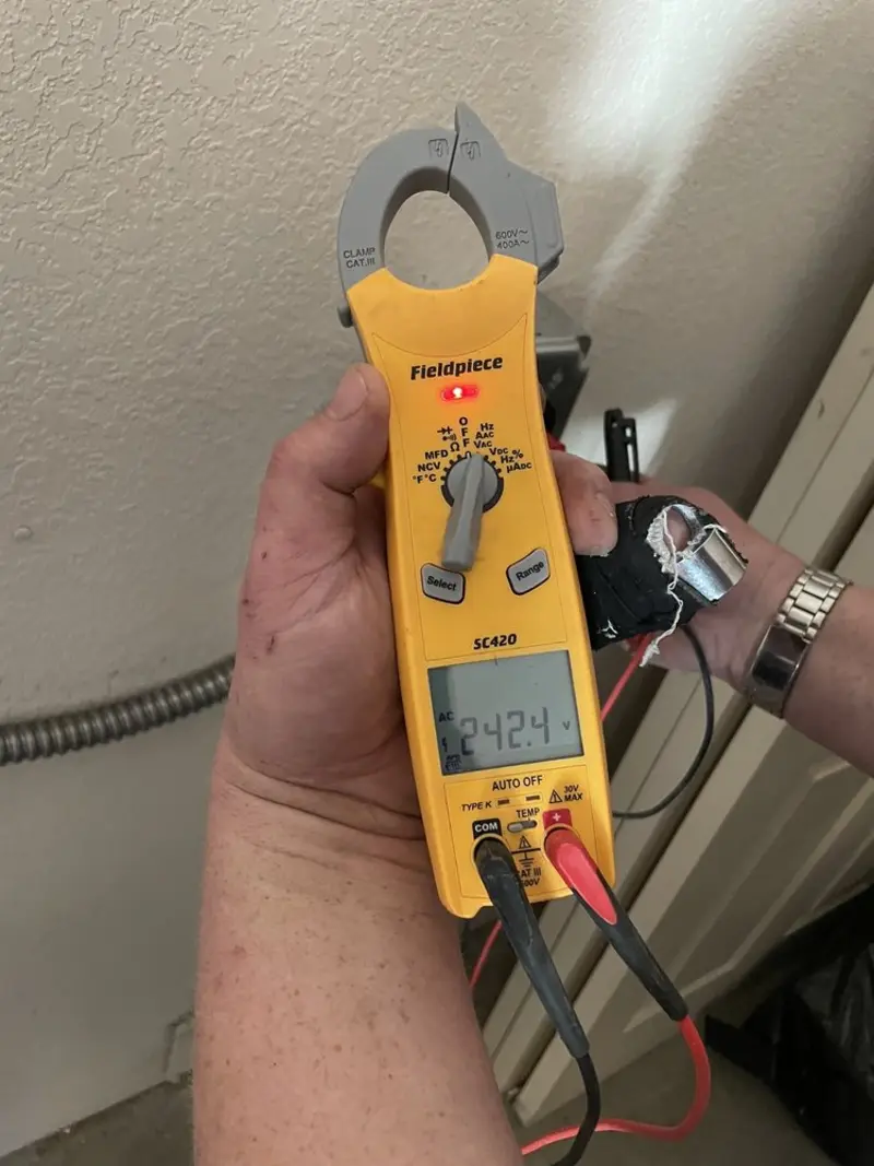 Voltage testing with clamp meter during Outlet Installation in Jamestown